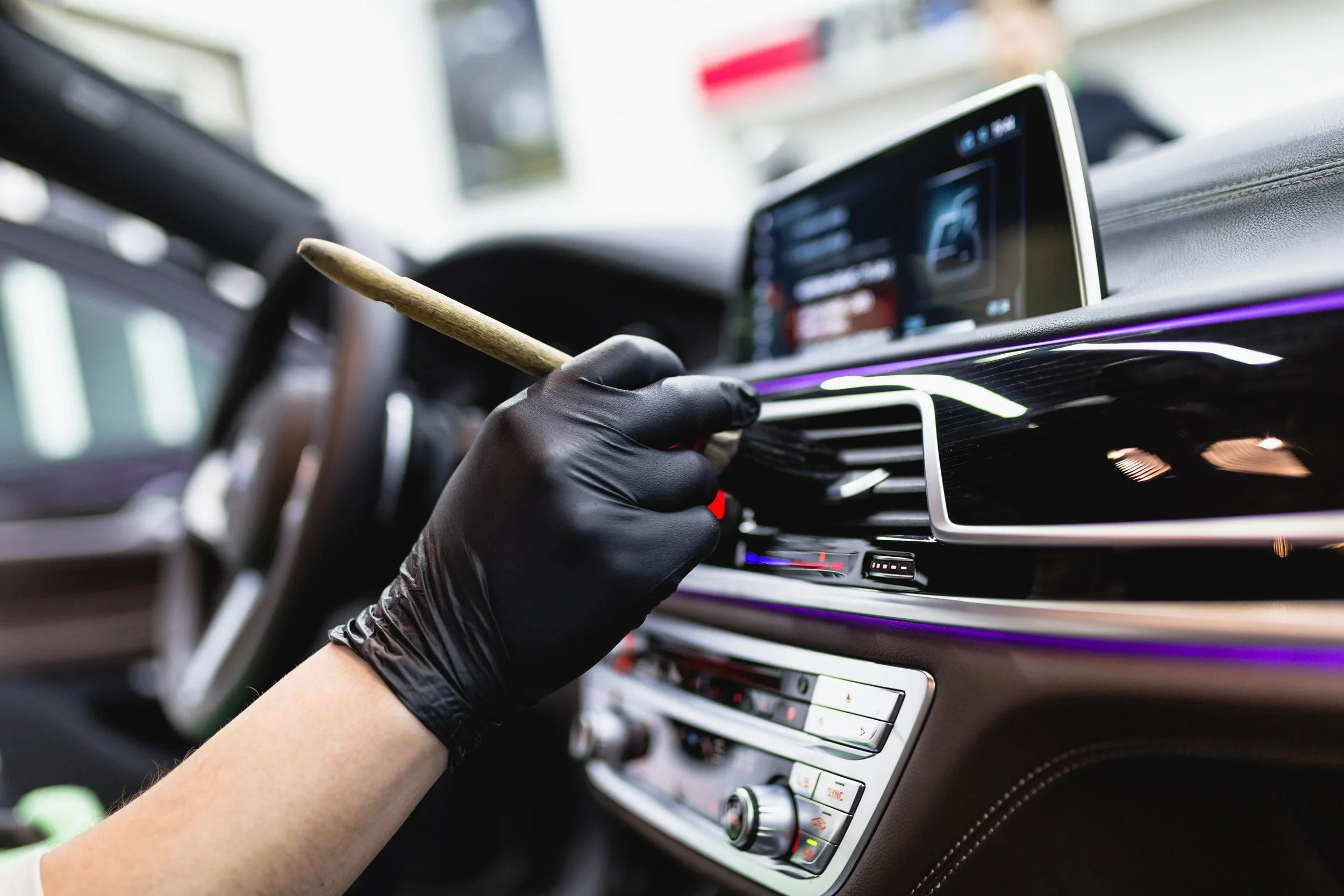 Interior car detailing in San Diego — deep cleaning dashboard, seats, and carpets